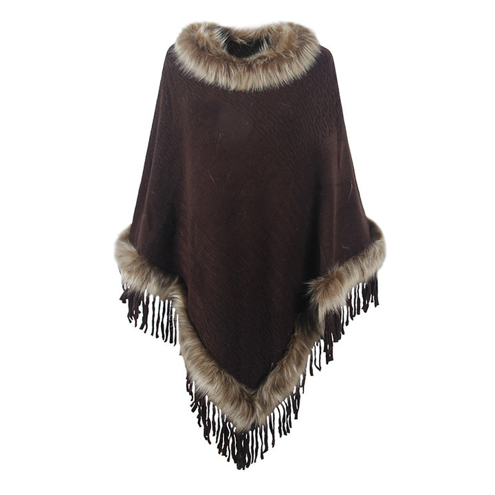 Damernas elegant poncho med lyxig fuskpälskrage och dekadenta fransar Mirla-Eva Jonsson