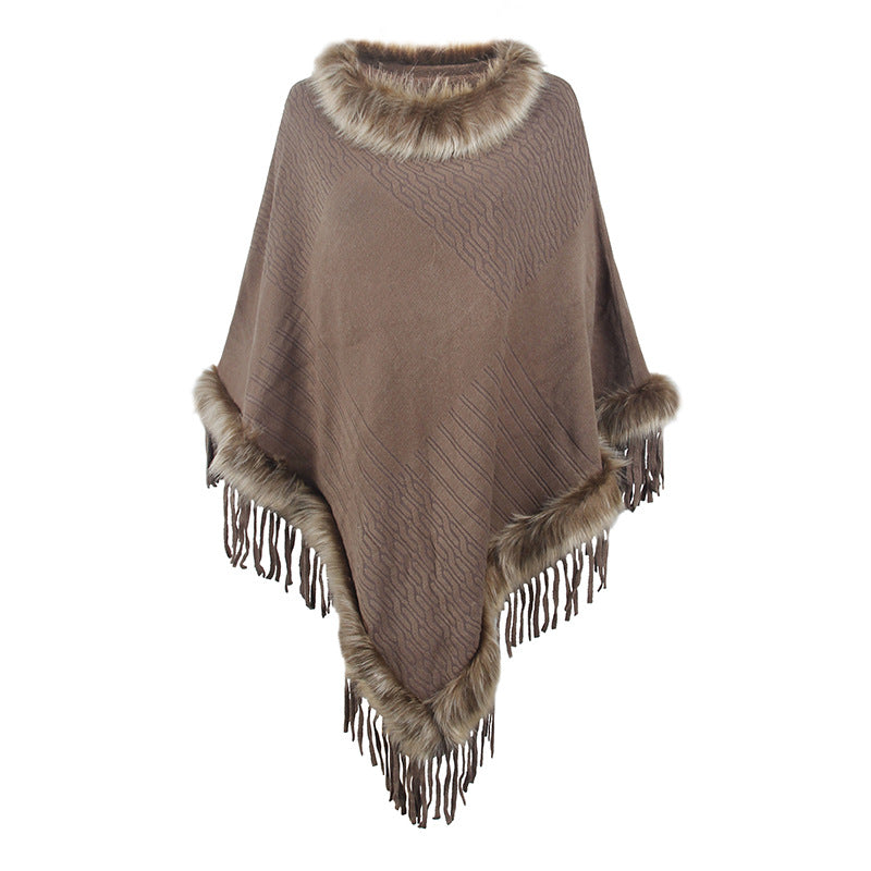 Damernas elegant poncho med lyxig fuskpälskrage och dekadenta fransar Mirla-Eva Jonsson