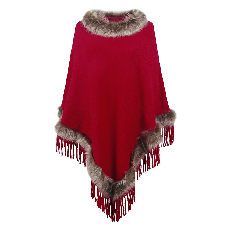 Damernas elegant poncho med lyxig fuskpälskrage och dekadenta fransar Mirla-Eva Jonsson