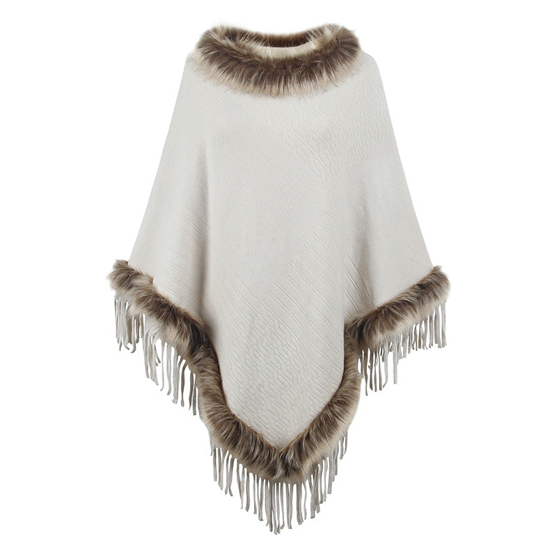 Damernas elegant poncho med lyxig fuskpälskrage och dekadenta fransar Mirla-Eva Jonsson