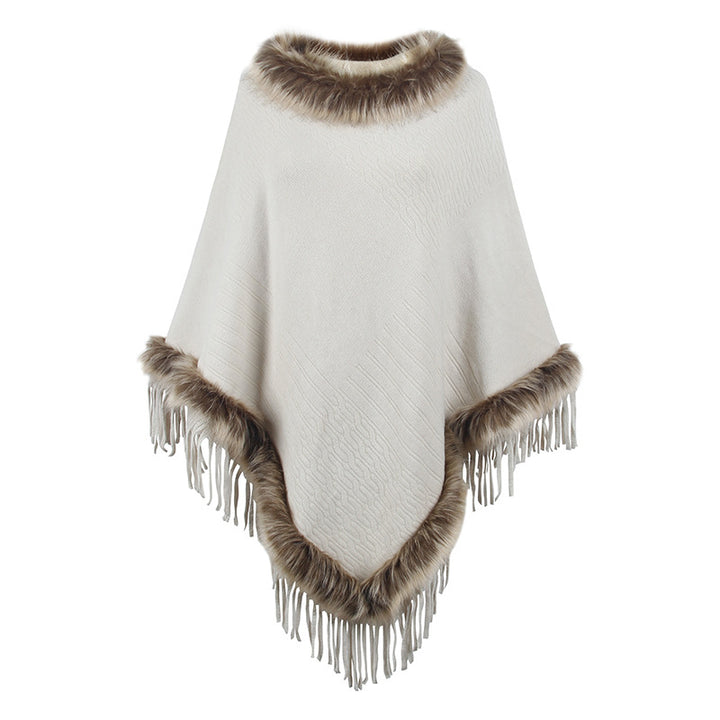 Damernas elegant poncho med lyxig fuskpälskrage och dekadenta fransar Mirla-Eva Jonsson