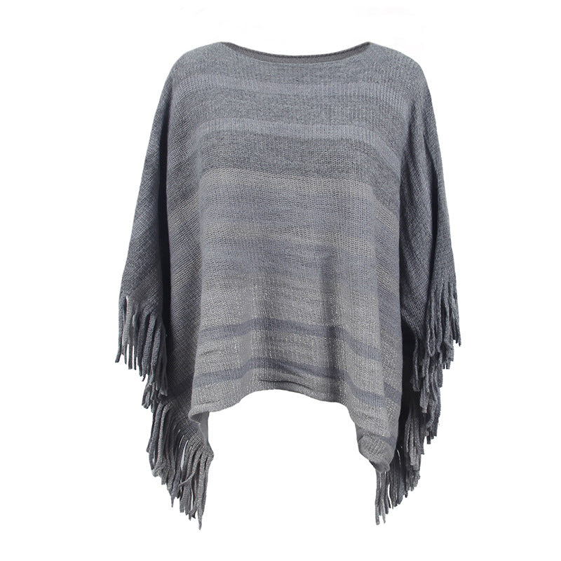 Damernas elegant poncho med strukturerad design och fransiga detaljer Mirla-Eva Jonsson