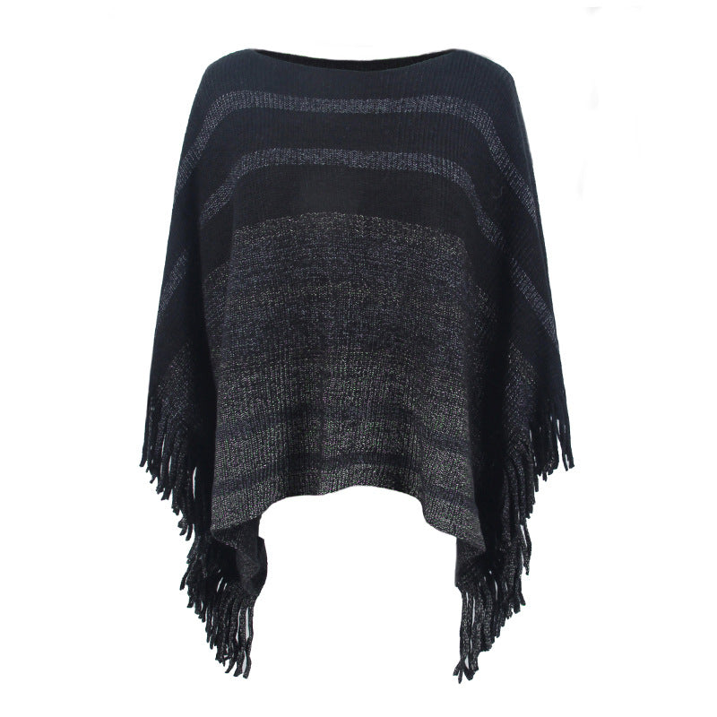 Damernas elegant poncho med strukturerad design och fransiga detaljer Mirla-Eva Jonsson