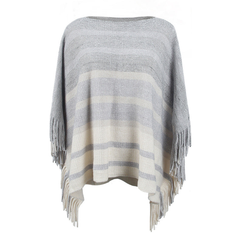 Damernas elegant poncho med strukturerad design och fransiga detaljer Mirla-Eva Jonsson