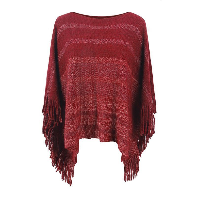 Damernas elegant poncho med strukturerad design och fransiga detaljer Mirla-Eva Jonsson