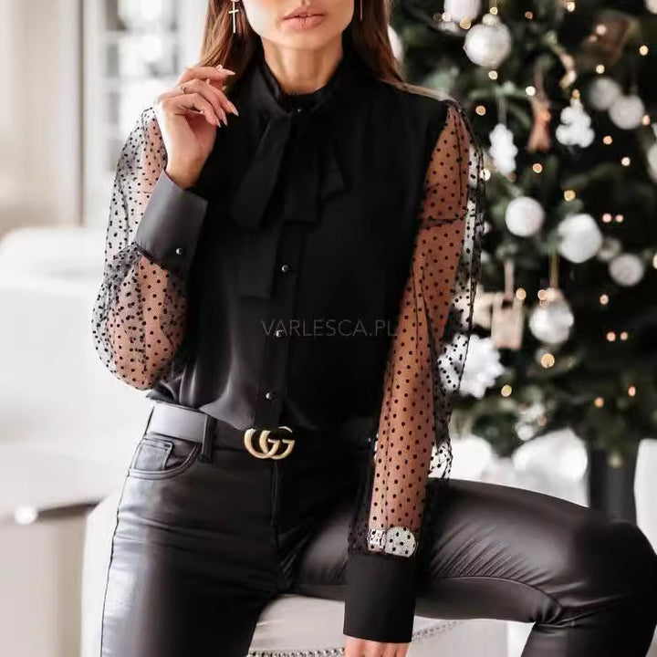 Damernas eleganta blus med genomskinliga puffärmar och slinga detalj Mirla-Eva Jonsson