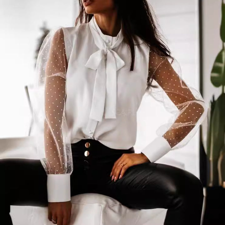 Damernas eleganta blus med genomskinliga puffärmar och slinga detalj Mirla-Eva Jonsson