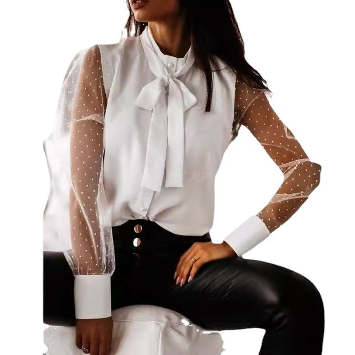 Damernas eleganta blus med genomskinliga puffärmar och slinga detalj Mirla-Eva Jonsson