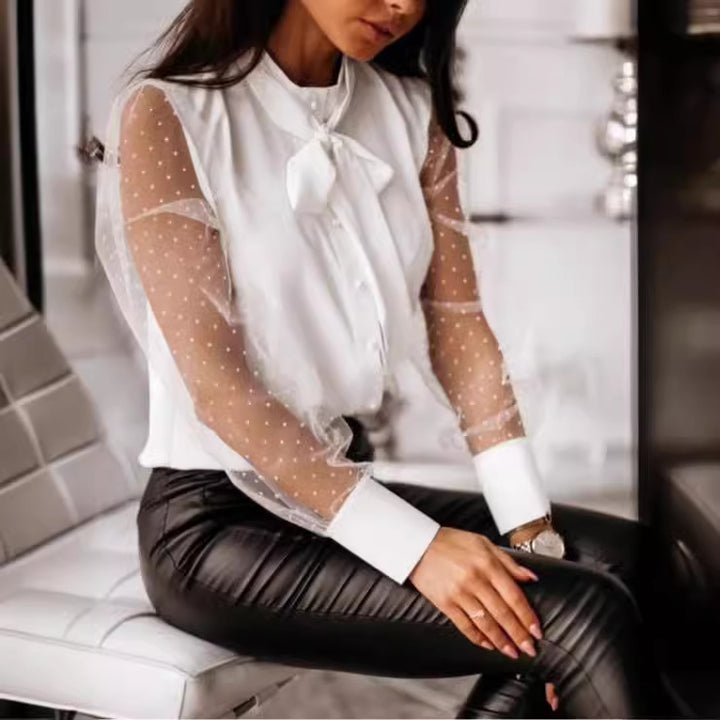 Damernas eleganta blus med genomskinliga puffärmar och slinga detalj Mirla-Eva Jonsson