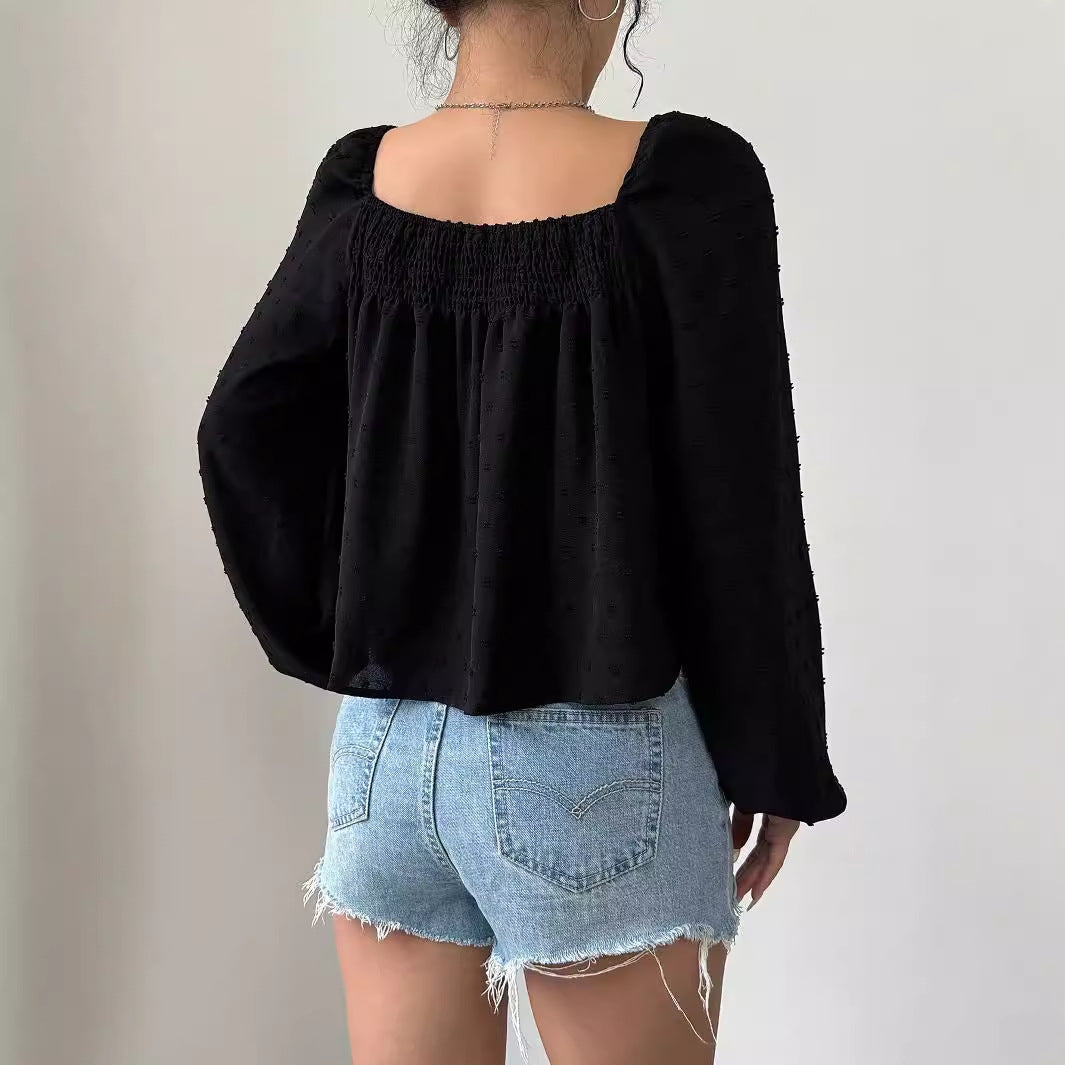Damernas eleganta blus med luftiga puffärmar och texturerad yta Mirla-Eva Jonsson