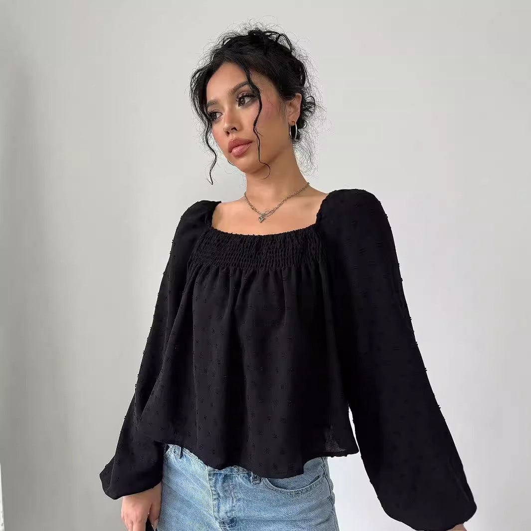 Damernas eleganta blus med luftiga puffärmar och texturerad yta Mirla-Eva Jonsson