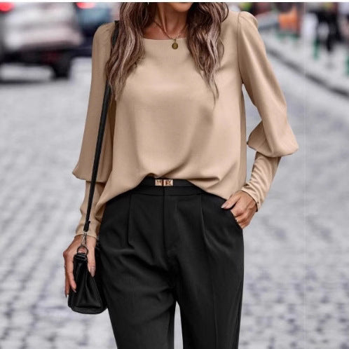 Damernas eleganta blus med puffärmsdetaljer och strukturerad tyg Mirla-Eva Jonsson