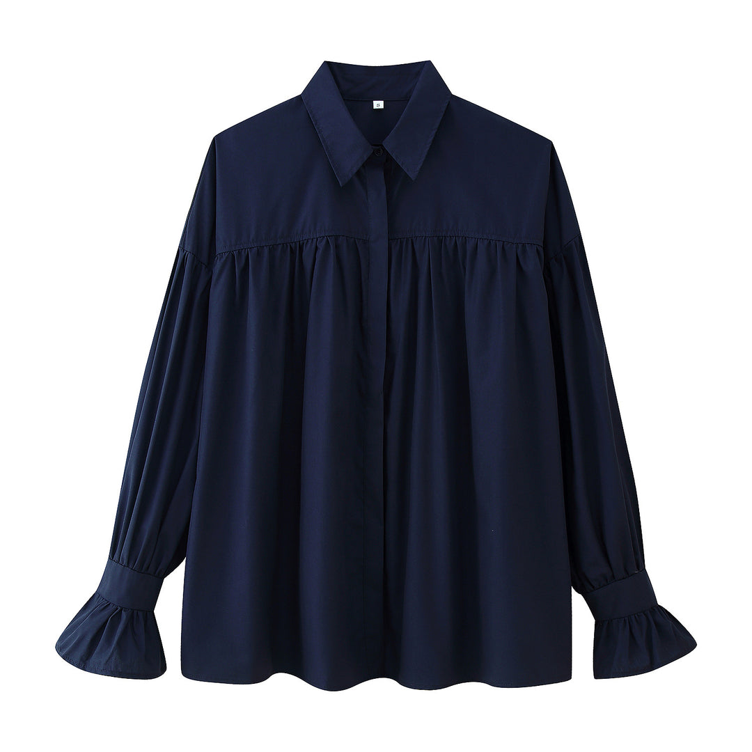 Damernas eleganta blus med voluminösa ärmar och feminina volanger Mirla-Eva Jonsson