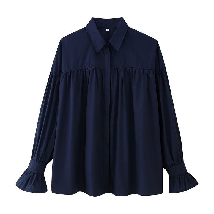 Damernas eleganta blus med voluminösa ärmar och feminina volanger Mirla-Eva Jonsson