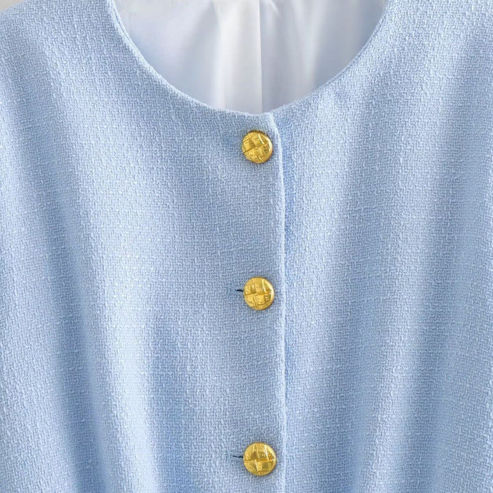 Damernas eleganta cropped jacka med gyllene knapplik detaljer Mirla-Eva Jonsson