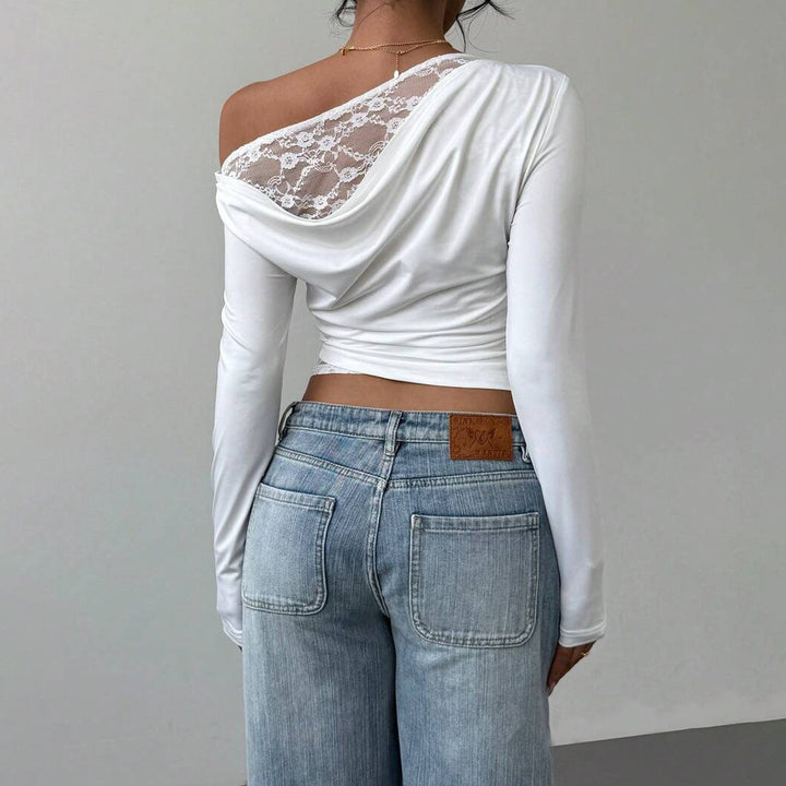 Damernas eleganta långärmade t-shirt med asymmetrisk halsringning och spetsdetalj Mirla-Eva Jonsson