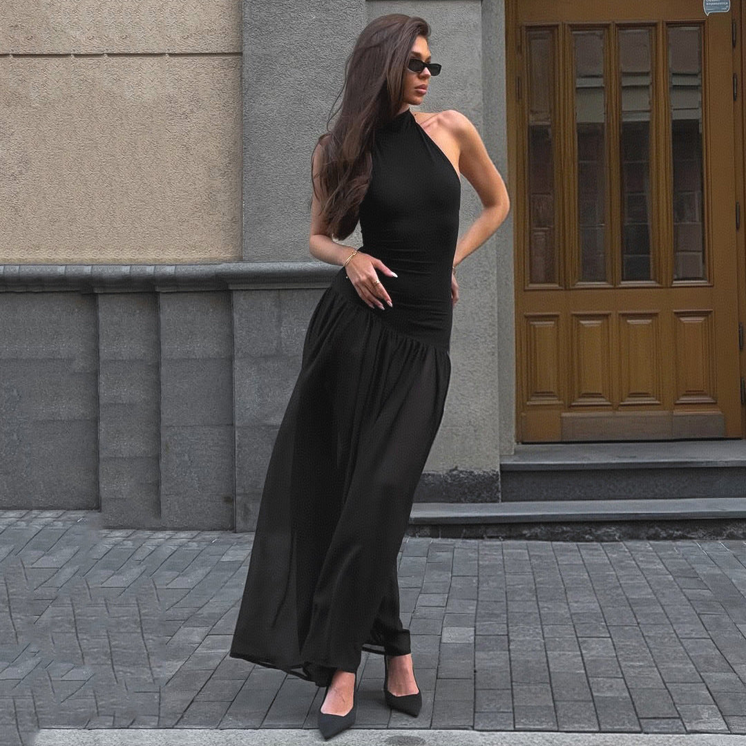 Damernas eleganta maxiklänning med raffinert halterdesign och genomskinlig kjol Mirla-Eva Jonsson