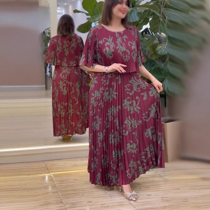 Damernas eleganta maxiklänning med ruffle-design och blommig skärning Mirla-Eva Jonsson