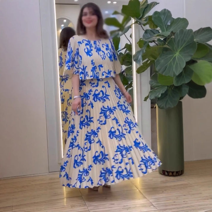 Damernas eleganta maxiklänning med ruffle-design och blommig skärning Mirla-Eva Jonsson