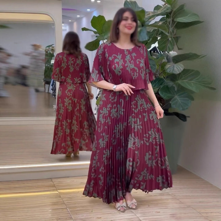 Damernas eleganta maxiklänning med ruffle-design och blommig skärning Mirla-Eva Jonsson