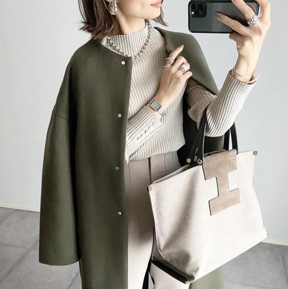 Damernas eleganta oversized vinterkappa med knapppdetaljer Mirla-Eva Jonsson