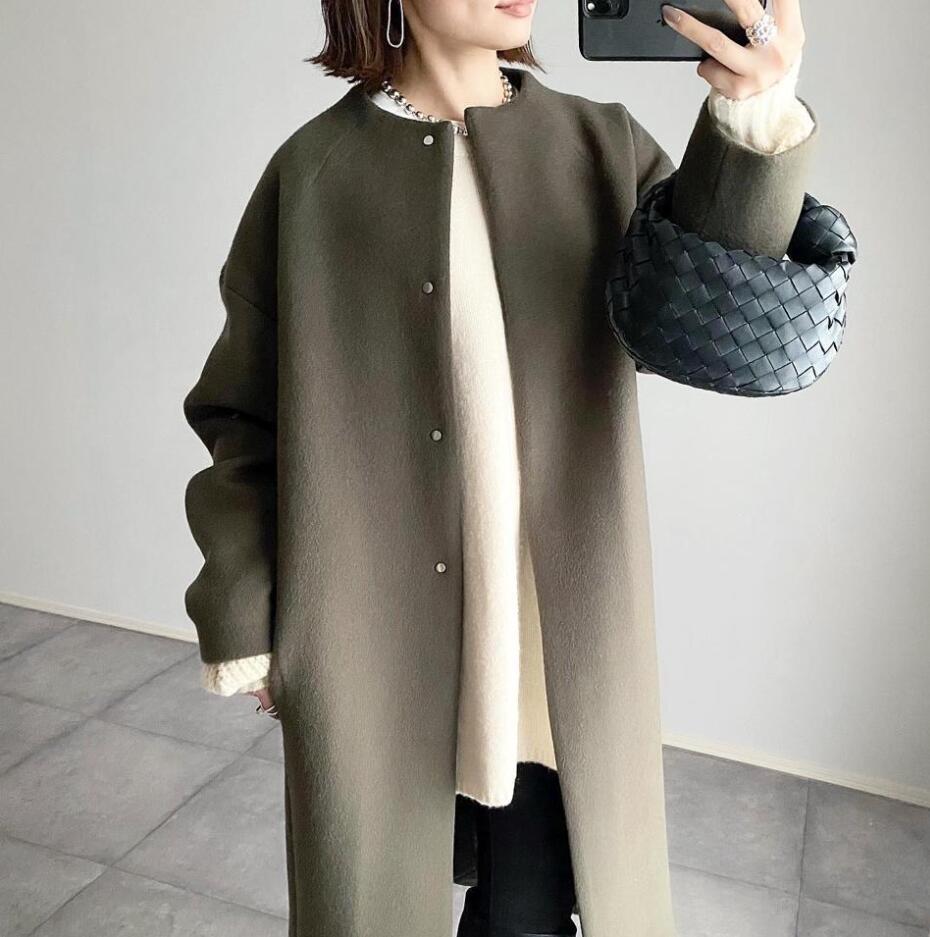 Damernas eleganta oversized vinterkappa med knapppdetaljer Mirla-Eva Jonsson