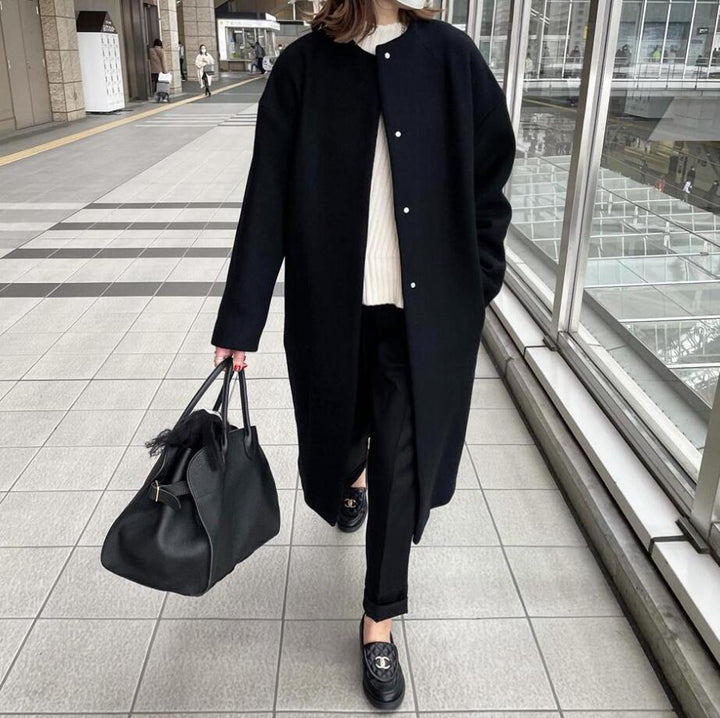 Damernas eleganta oversized vinterkappa med knapppdetaljer Mirla-Eva Jonsson