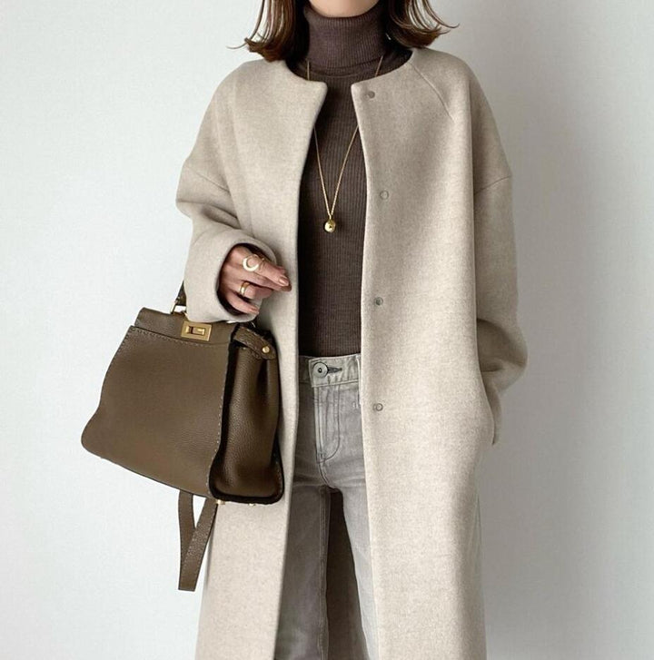 Damernas eleganta oversized vinterkappa med knapppdetaljer Mirla-Eva Jonsson