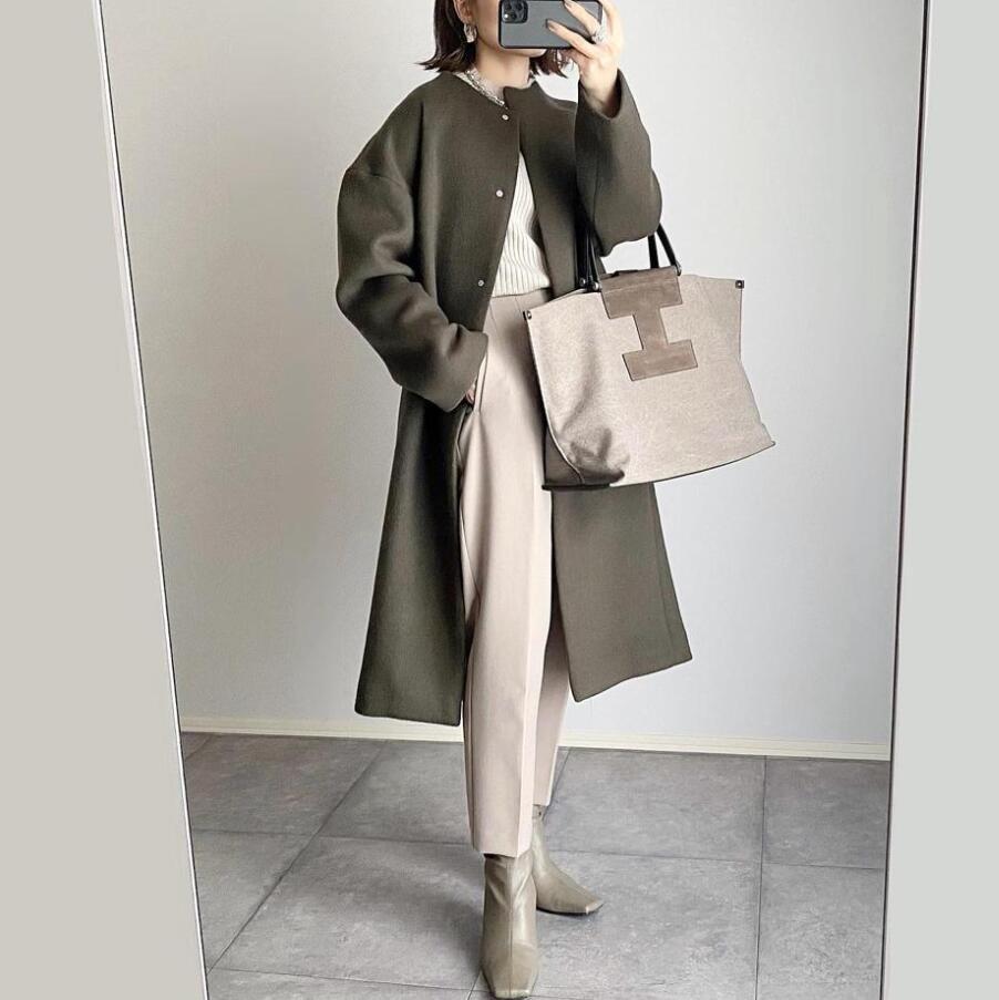 Damernas eleganta oversized vinterkappa med knapppdetaljer Mirla-Eva Jonsson