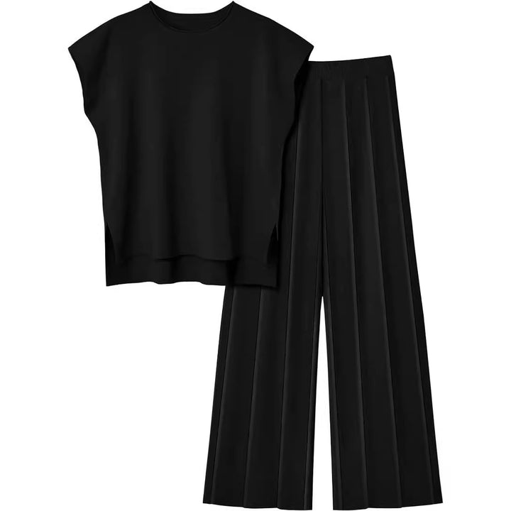 Damernas eleganta set med kortärmad topp och plisserad byxa Mirla-Eva Jonsson