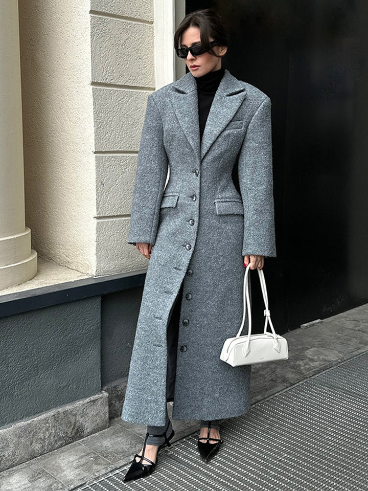 Damernas eleganta ullkappa med strukturerad design och praktiska fickor Eva Jonsson-Eva Jonsson