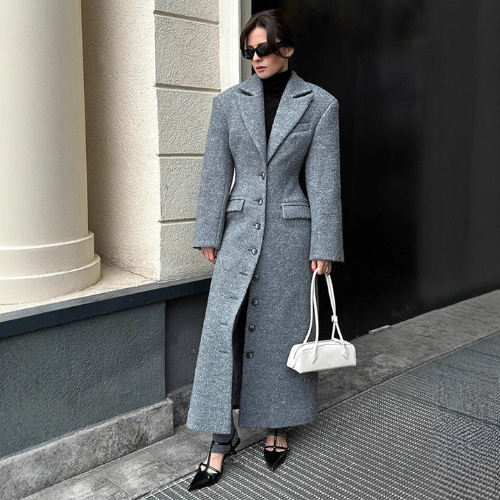 Damernas eleganta ullkappa med strukturerad design och praktiska fickor Eva Jonsson-Eva Jonsson