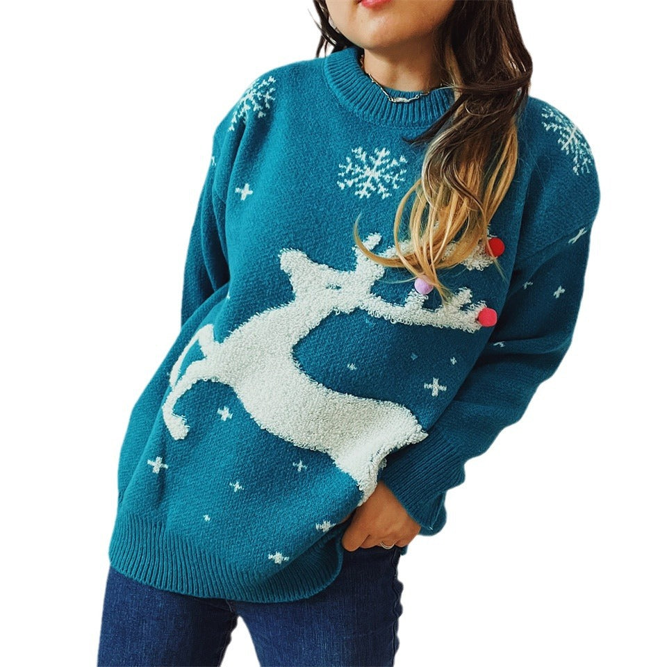 Damernas festliga tröja med kreativ renmotiv och strukturerad stickning Mirla-Eva Jonsson