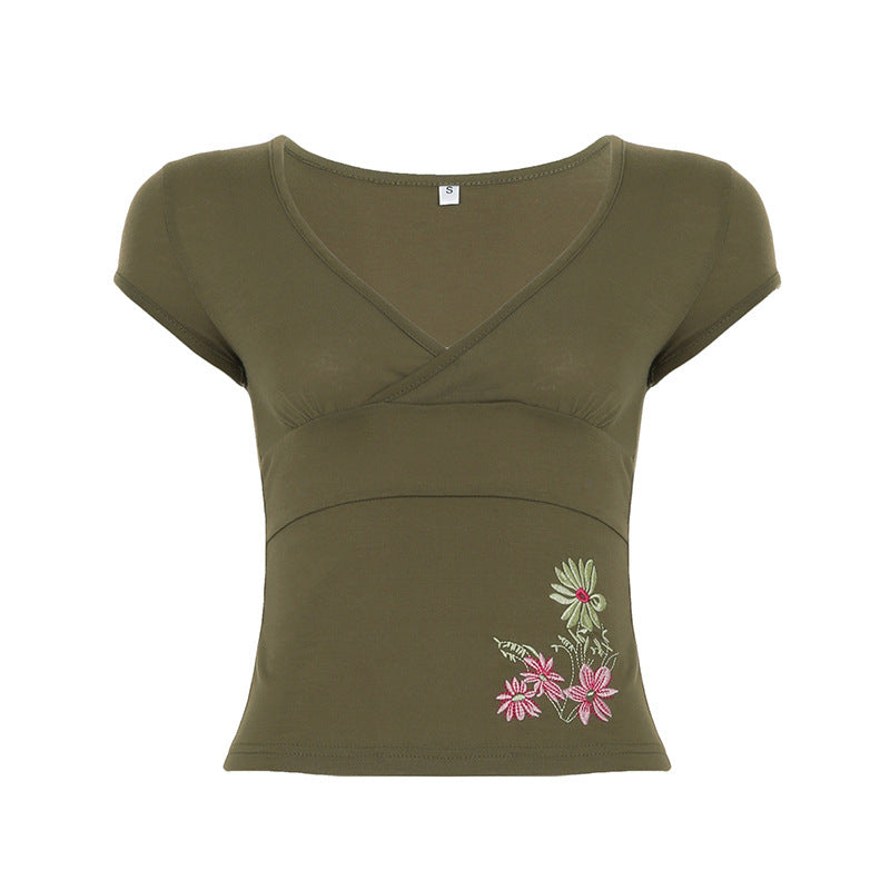 Damernas figurnära kortärmad t-shirt med blommigt broderimönster Mirla-Eva Jonsson