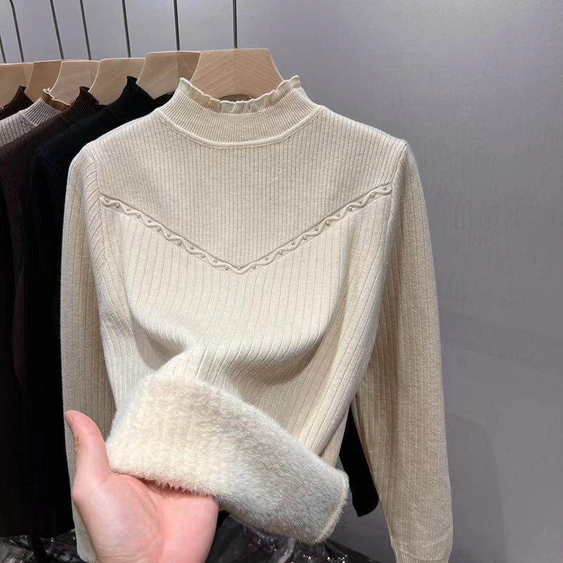 Damernas finstickad tröja med elegant ribbdesign och mjuk krage Mirla-Eva Jonsson
