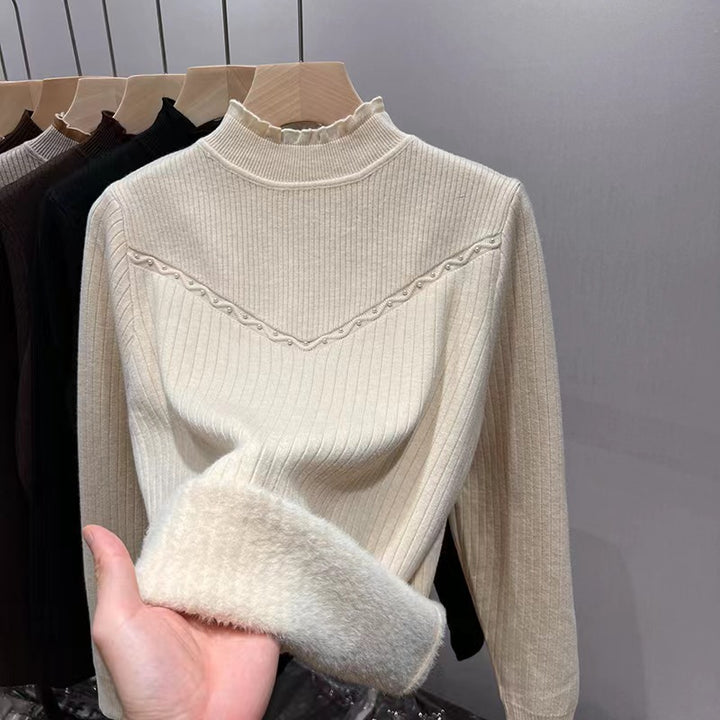 Damernas finstickad tröja med elegant ribbdesign och mjuk krage Mirla-Eva Jonsson