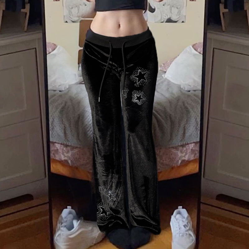 Damernas flare joggingsbyxor med glittrande stjärnapplikationer Mirla-Eva Jonsson