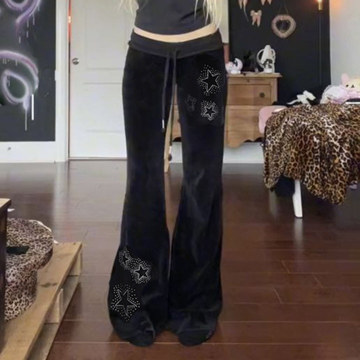 Damernas flare joggingsbyxor med glittrande stjärnapplikationer Mirla-Eva Jonsson