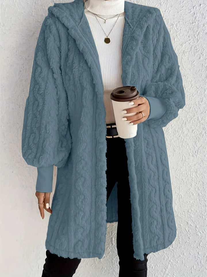 Damernas fleece-hoodie-jacka med voluminösa ärmar och praktisk huva Mirla-Eva Jonsson