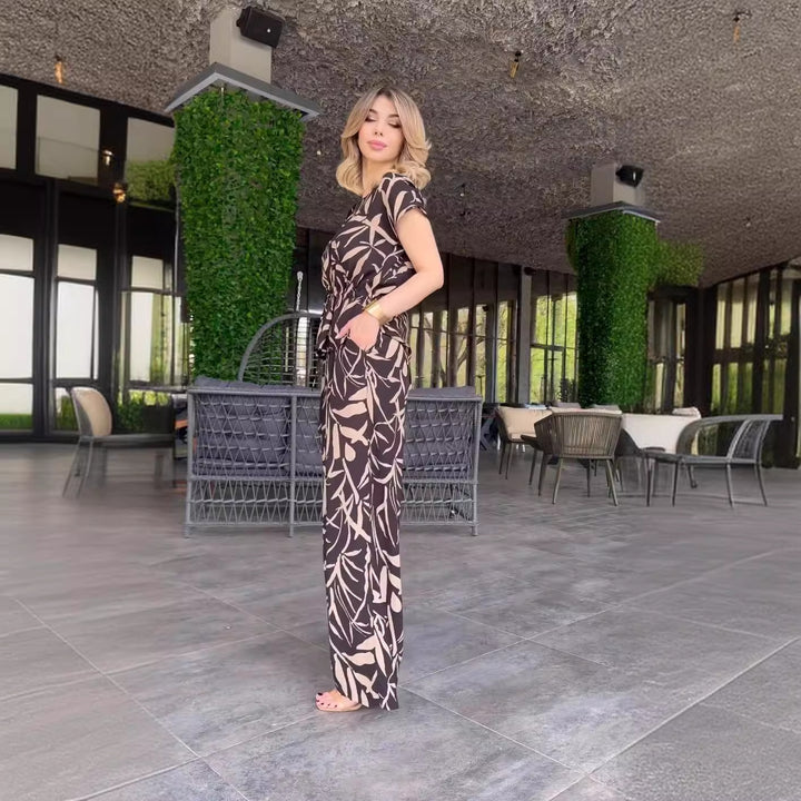 Damernas flödande jumpsuit med blommönster och elastisk midja Mirla-Eva Jonsson