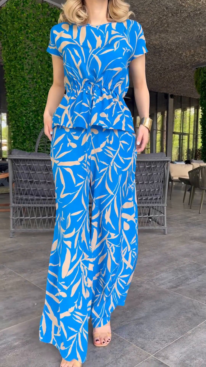 Damernas flödande jumpsuit med blommönster och elastisk midja Mirla-Eva Jonsson