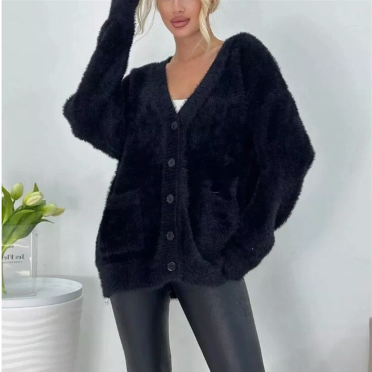 Damernas fluffiga cardigan med stora fickor och avslappnad passform Mirla-Eva Jonsson