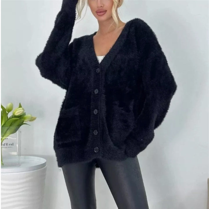 Damernas fluffiga cardigan med stora fickor och avslappnad passform Mirla-Eva Jonsson
