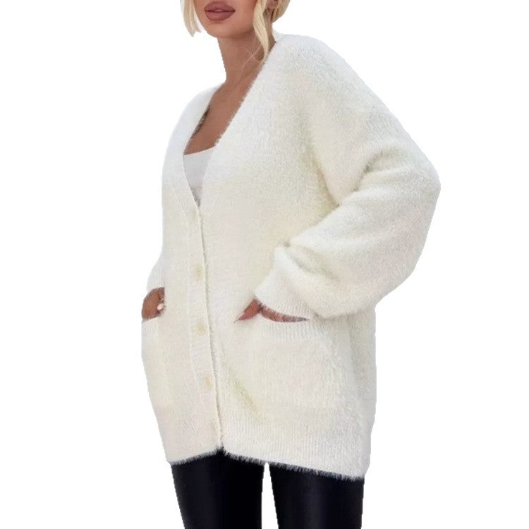 Damernas fluffiga cardigan med stora fickor och avslappnad passform Mirla-Eva Jonsson
