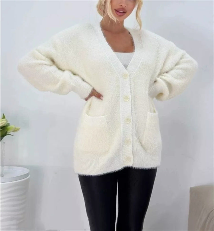 Damernas fluffiga cardigan med stora fickor och avslappnad passform Mirla-Eva Jonsson