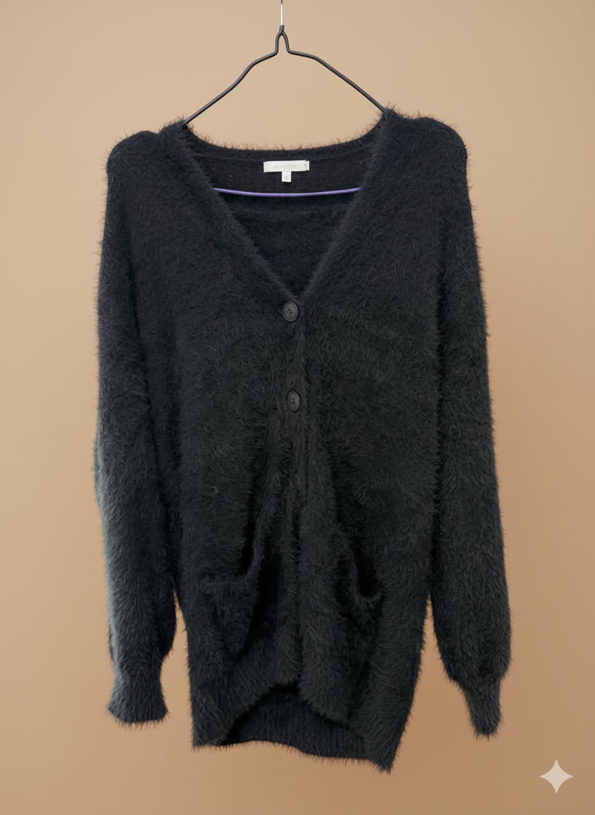 Damernas fluffiga cardigan med stora fickor och avslappnad passform Mirla-Eva Jonsson