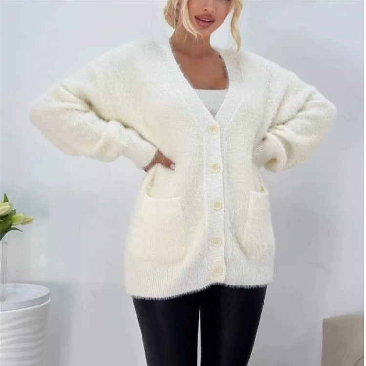 Damernas fluffiga cardigan med stora fickor och avslappnad passform Mirla-Eva Jonsson