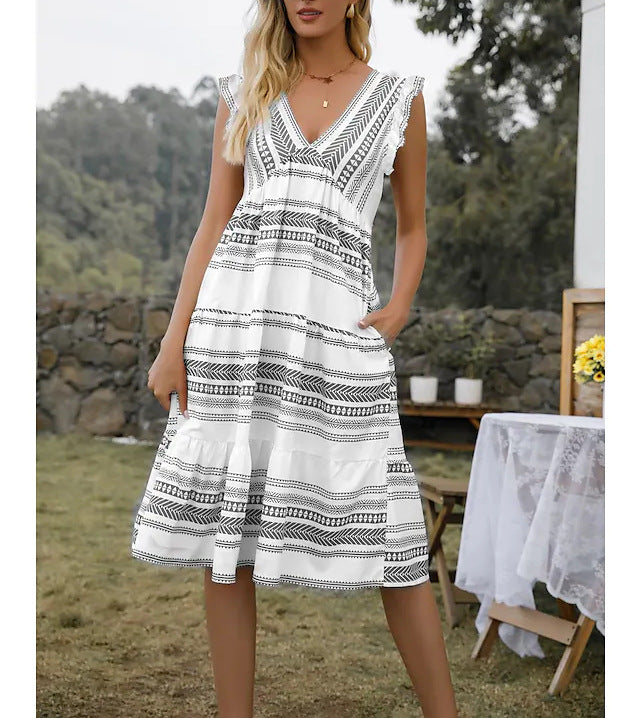 Damernas fritidsklänning med raffinerade volangdetaljer och stiligt bältesdesign Eva Jonsson-Eva Jonsson