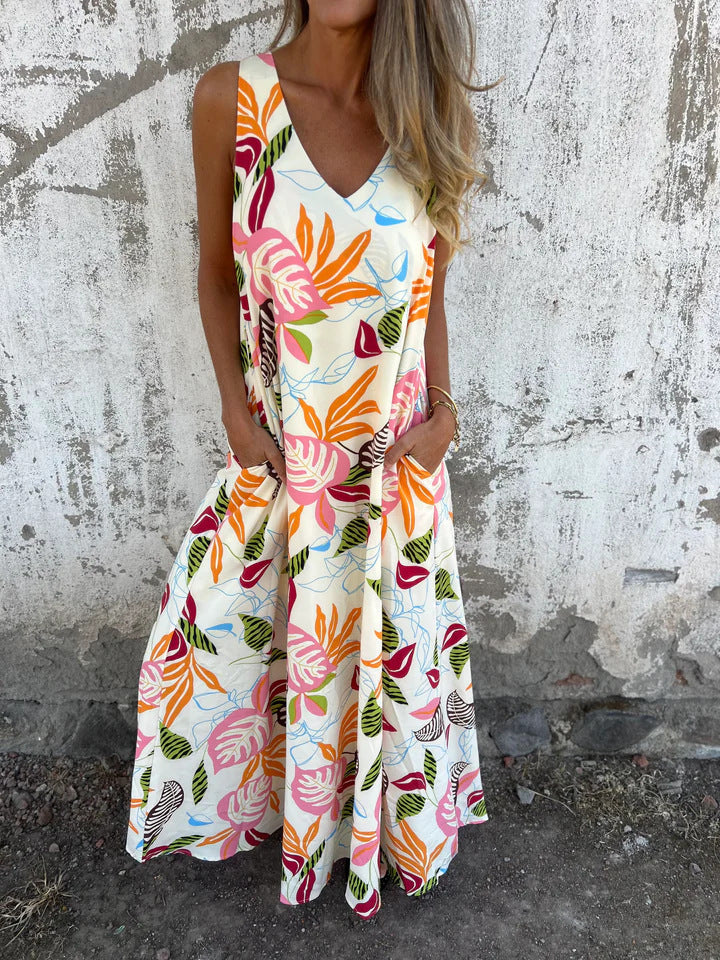 Damernas fritidsmaxiklänning med blommigt mönster och praktiska fickor Eva Jonsson-Eva Jonsson