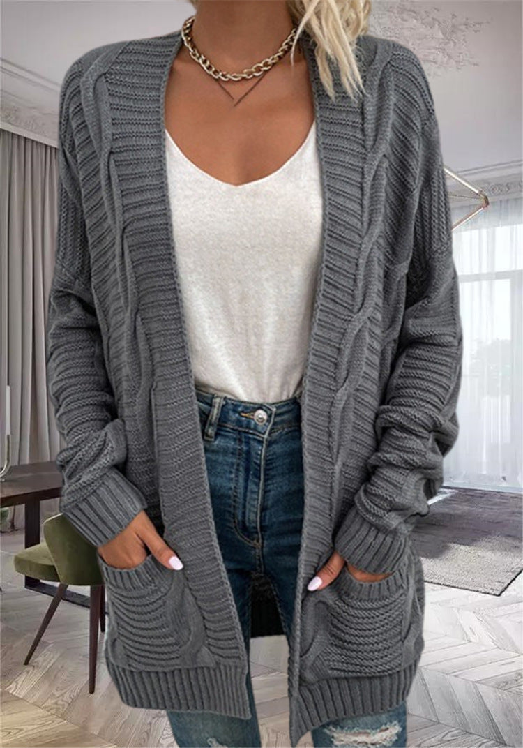 Damernas grovstickad cardigan med strukturerade ärmar och djupa fickor Mirla-Eva Jonsson